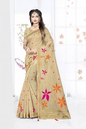 Here Is A Very Pretty Silk Based Saree In Beige Color. This Saree Is Fabricated On Weaving Silk Paired With Art Silk Fabricated Blouse. It Is Light In Weight And Easy To Carry All Day Long. 