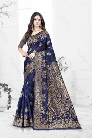 Enhance Your Personality Wearing This Rich Silk Based Designer Saree In Navy Blue Color Paired With Navy Blue Colored Blouse. This Saree Is Beautified With Bold Weave Giving It An Enhanced Look.