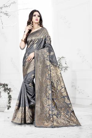 Enhance Your Personality Wearing This Rich Silk Based Designer Saree In Grey Color Paired With Navy Blue Colored Blouse. This Saree Is Beautified With Bold Weave Giving It An Enhanced Look.