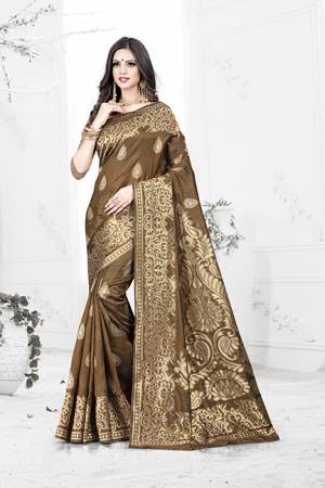 Enhance Your Personality Wearing This Rich Silk Based Designer Saree In Brown Color Paired With Navy Blue Colored Blouse. This Saree Is Beautified With Bold Weave Giving It An Enhanced Look.