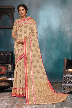 Flaunt Your Rich And Elegant Taste In This Elegant Looking Cream Colored Saree. This Saree Is Fabricated On Handloom Cotton Silk Paired With Jacquard Silk Fabricated Blouse. It Is Beautified With Weave Giving An Enhanced Look.