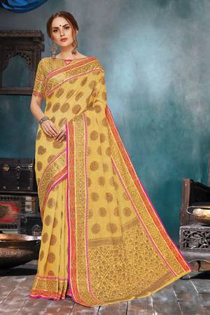 Celebrate This Festive Season In A Very Elegant Look With This Silk Based Occur Yellow Colored Saree. This Saree IS Fabricated On Handloom Cotton Silk Paired With Jacquard Silk Fabricated Blouse. 