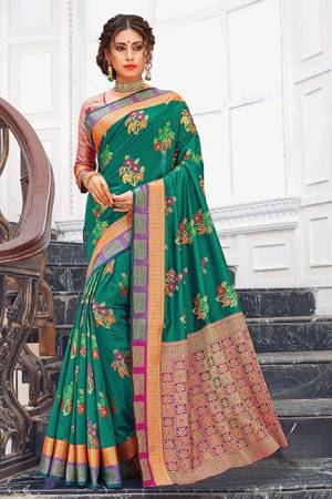 Celebrate This Festive Season Wearing This Designer Saree In Teal Green Color Paired With Contrasting Pink Colored Blouse. This Saree And Blouse Are Silk Based Which Gives A Rich Look T Your Personality. 