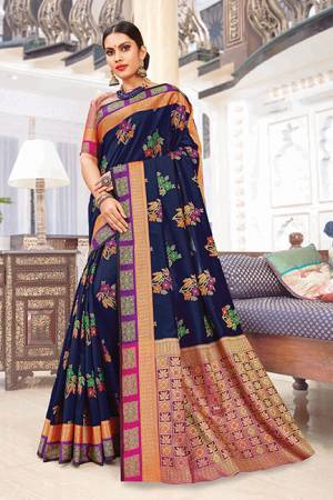 Celebrate This Festive Season Wearing This Designer Saree In Navy Blue Color Paired With Contrasting Pink Colored Blouse. This Saree And Blouse Are Silk Based Which Gives A Rich Look T Your Personality. 