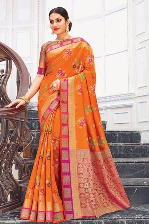 Bright And Appealing Color Is Here With This Silk Based Saree In Orange Color Paired With Contrasting Dark Pink Colored Blouse. This Saree Is Weaving Silk Based Paired With Jacquard Silk Fabricated Blouse. Its Fabric Is Durable And Easy To Care For.