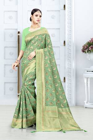 Grab This Pretty Floral Saree In Green Color Paired With Green Colored Blouse. This Saree Is Fabricated On Weaving Silk Paired With Art Silk Fabricated Blouse. This Pretty Saree Is Light Weight, Durable And Easy To Care For.