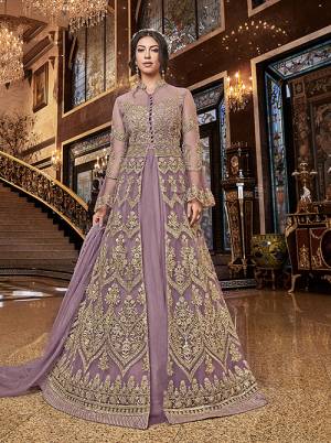 Lovely Shade Is Here To Add Into Your Wardrobe With This Two-Way Indo-Western Suit In Lilac Color. Its Heavy Embroidered Top Is Fabricated On Net Paired With Art Silk Fabricated Embroidered Bottom And Net Fabricated Lehenga With Net Dupatta. Buy This Pretty Suit Now.