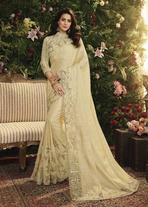 Flaunt Your Rich And Elegant Taste Wearing This Elegant Looking Designer Saree Cream Color Paired With Cream Colored Blouse. This Saree Is Fabricated On Satin Silk And Net Paired With Art Silk And Net Fabricated Blouse. It Is Beautified With Attrative Fancy Embroidery which Will Earn You Lots Of Compliments From Onlookers. 