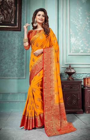 This Festive Season Be The Most Elegant In Traditional Wear With This Silk Based Saree In Orange Color Paired With Contrasting Red Colored Blouse. Its Rich Fabric Is Durable, Light Weight And Easy To Care For.