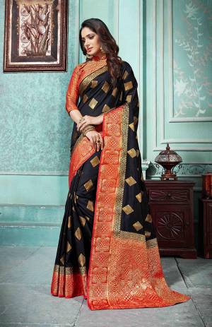 Grab This Beautiful Designer Silk Based Saree In Black Color Paired With Red Colored Blouse. This Saree And Blouse Are Fabricated On Art Silk Beautified With Weave All Over. Buy Now.