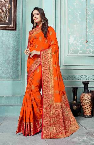 This Festive Season Be The Most Elegant In Traditional Wear With This Silk Based Saree In Dark Orange Color Paired With Contrasting Red Colored Blouse. Its Rich Fabric Is Durable, Light Weight And Easy To Care For.