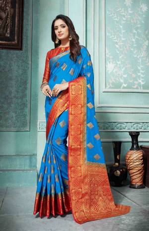 Grab This Beautiful Designer Silk Based Saree In Blue Color Paired With Red Colored Blouse. This Saree And Blouse Are Fabricated On Art Silk Beautified With Weave All Over. Buy Now.