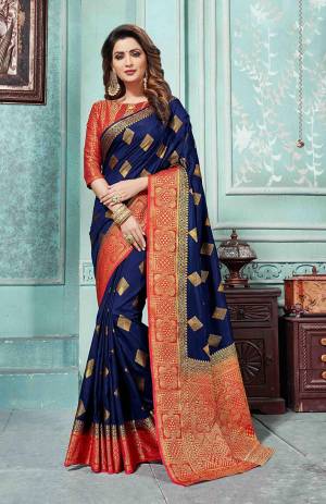Grab This Beautiful Designer Silk Based Saree In Navy Blue Color Paired With Red Colored Blouse. This Saree And Blouse Are Fabricated On Art Silk Beautified With Weave All Over. Buy Now.