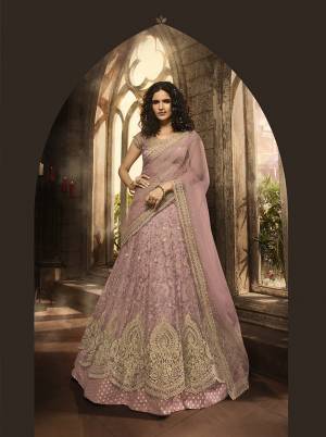 New Shade In Purple Is Here With This Heavy Designer Lehenga Choli In Lilac Color. Its Blouse, Lehenga And Dupatta Are Fabricated On Net Beautified With Heavy Jari And Resham Embroidery With Stone Work. Buy Now.