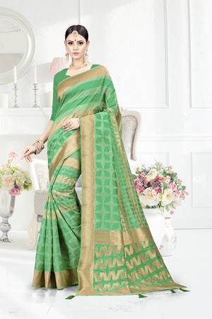 Look Pretty In This Designer Silk Based Green Colored Geonmetric Patterned Saree Paired With Green Colored Blouse. This Saree Is Fabricated On Weaving Silk Paired With Art Silk Fabricated Blouse. Buy This Saree Now