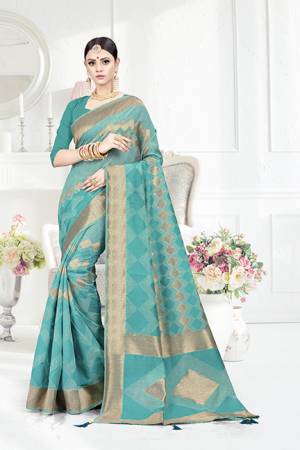 Look Pretty In This Designer Silk Based Turquoise Blue Colored Geonmetric Patterned Saree Paired With Turquoise Blue Colored Blouse. This Saree Is Fabricated On Weaving Silk Paired With Art Silk Fabricated Blouse. Buy This Saree Now
