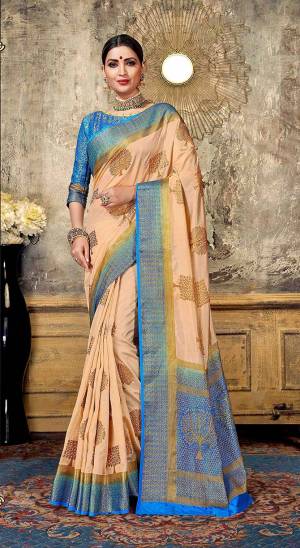 Look Elegant With This Rich Looking Silk Based Saree In Light Peach Color Paired With Contrasting Blue Colored Blouse. This Saree Is Fabricated On Art Silk Paired With Jacquard Silk Fabricated Blouse. It Is Beautified With Elegant Weave Giving An Attractive Look. 