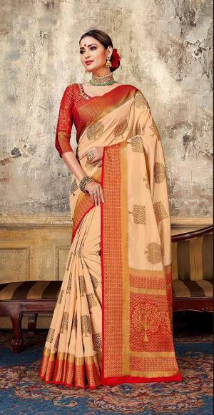 Look Elegant With This Rich Looking Silk Based Saree In Light Peach Color Paired With Contrasting Red Colored Blouse. This Saree Is Fabricated On Art Silk Paired With Jacquard Silk Fabricated Blouse. It Is Beautified With Elegant Weave Giving An Attractive Look. 