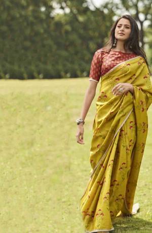 Celebrate This Festive Season With Beauty And Comfort Wearing This Lovely Floral Printed Saree In Musturd Yellow Color Paired With Contrasting Rust Colored Blouse. This Silk Based Saree Is Light Weight And Also Gives A Rich Look. 