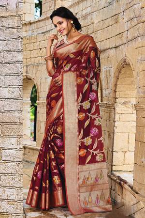Add This Beautiful Designer Silk Based Saree To Your Wardrobe In Maroon Color For This Festive And Wedding Season. This Rich Silk Based Saree Will Definitely Earn You Lots Of Compliments Which Is Trending This Season. 
