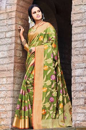 Add This Beautiful Designer Silk Based Saree To Your Wardrobe In Green Color For This Festive And Wedding Season. This Rich Silk Based Saree Will Definitely Earn You Lots Of Compliments Which Is Trending This Season. 