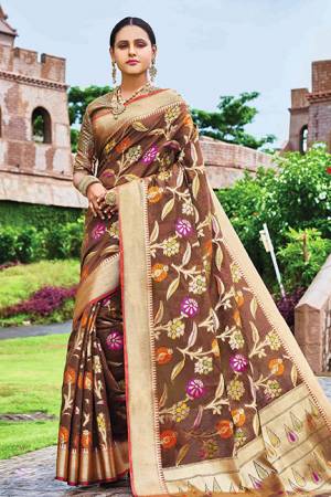 Add This Beautiful Designer Silk Based Saree To Your Wardrobe In Brown Color For This Festive And Wedding Season. This Rich Silk Based Saree Will Definitely Earn You Lots Of Compliments Which Is Trending This Season. 