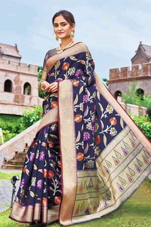 Add This Beautiful Designer Silk Based Saree To Your Wardrobe In Navy Blue Color For This Festive And Wedding Season. This Rich Silk Based Saree Will Definitely Earn You Lots Of Compliments Which Is Trending This Season. 