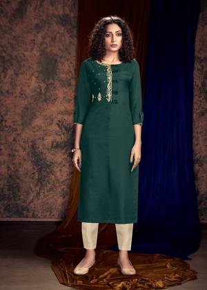 Here Is A Beautiful Shade To Add Into Your Wardrobe With This Readymade Kurti In Teal Green Color Paired With Cream Colored Bottom. Its Top Is Silk Based Paired With Satin Cotton Fabricated Readymade Bottom. 
