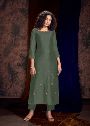 New And Unique Shade IS Here To Add Into Your Wardrobe With This Readymade Pair Of Kurti And Plazzo In Teal Grey Color. This Lovely Designer Pair Is Fabricated On Art Silk Which Also Gives A Rich Look To Your Personality. 