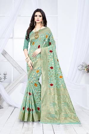 Shine Bright In This Designer Silk Based Saree In Sea Green Color Paired With Sea Green Colored Blouse. This Saree Is Fabricated On Weaving Silk Paired With Art Silk Fabricated Blouse. It Has Rich Fabric Beautified With Detailed Weave All Over. Buy Now.