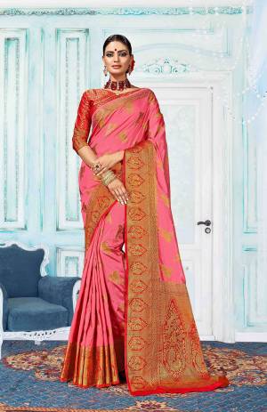 Go With Pretty Shades With This Pink Colored Saree Paired With Red Colored Blouse. This Saree Is Fabricated On Art Silk Paired With Jacquard Silk Fabricated Blouse. It Is Beautified With Weave All Over. Buy Now.
