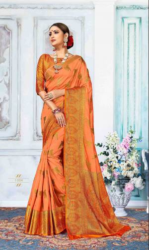 Go With The Shades Of Orange With This Orange Colored Saree Paired With Dark Orange Colored Blouse. This Saree Is Fabricated On Art Silk Paired With Jacquard Silk Fabricated Blouse. It Is Beautified With Weave All Over. Buy Now.