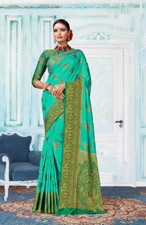 Go With The Shades Of Green With This Sea Green Colored Saree Paired With Green Colored Blouse. This Saree Is Fabricated On Art Silk Paired With Jacquard Silk Fabricated Blouse. It Is Beautified With Weave All Over. Buy Now.