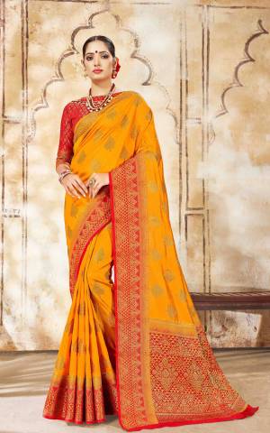 Celebrate This Festive Season Wearing This Designer Saree In Musturd Yellow Color Paired With Contrasting Red Colored Blouse. This Saree Is Fabricated On Art Silk Paired With Jacquard Silk Fabricated Blouse. 