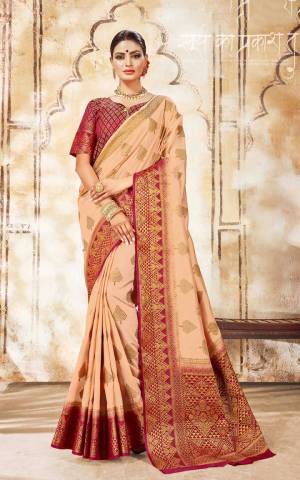 Flaunt Your Rich And Elegant Taste In This Pretty Silk Based Saree In Peach Color Paired With Contrasting Maroon Colored Blouse. Buy This Heavy Weaved Saree Now.