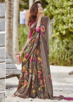 For Your Semi-Casuals, Grab This Lovely Floral Printed Saree In Brown Color Paired With Rani Pink Colored Blouse. This Saree And Blouse Are Fabricated On Soft Linen Which Also Gives A Rich Look To Your Personality. 