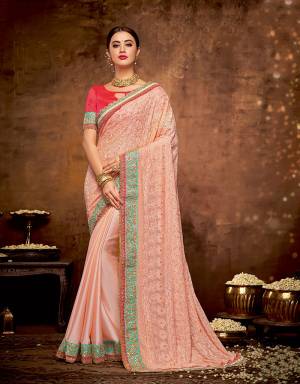Emanate inevitable charm and look graceful in this subtle and sophiticated saree with delicate threadwork. Let the pallu fall naturally to keep it raw and pretty. 