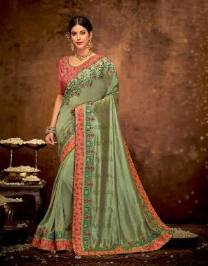 Indulge in a vintage style attire this festive season and exude an old world charm in this floral-embroidered saree .