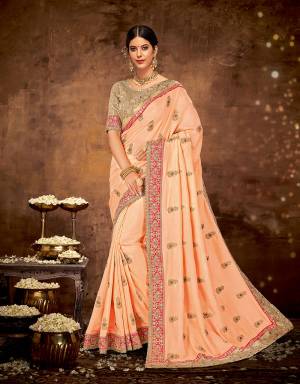 Celebrate your special day in this pastel colored , ethnicity-inspired saree with buttis and look exceptional. Couple the look with delicate jhumkis. 