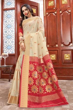 Flaunt Your Rich And Elegant Taste Wearing This Rich Silk Based Saree In Cream Color Paired With Contrasting Red Colored Blouse. This Saree Is Fabricated On Cotton Silk Paired With Art Silk Fabricated Blouse. Its Rich Color Pallete And Fabric Will Definitely Earn You Lots Of Compliments From Onlookers.