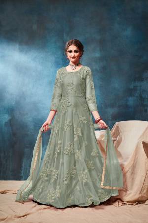 This Wedding & Festive Season, Grab This Heavy Designer Floor Length Suit In Mint Green Color. Its Embroidered Top Is Fabricated On Net Paired With Santoon Bottom And Net Fabricated Dupatta. Buy Now.