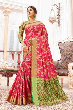 Celebrate This Festive Season With Beauty And Comfort Wearing This Designer Silk Based Saree In Dark Pink Color Paired With Contrasting Green Colored Blouse. This Saree And Blouse Are Beautified With Weave Giving It An Attractive Look. 