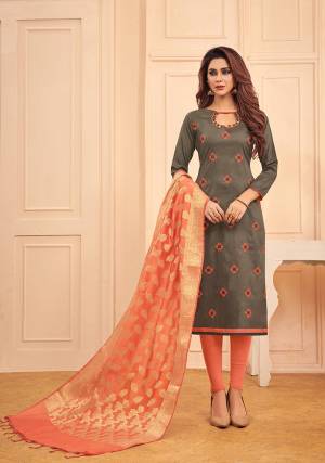 Here Is An Elegant Designer Straight Suit In Dark Grey Color Paired With Peach Colored Bottom And Dupatta. This Dress Material Is Cotton Based Paired With Banarasi Silk Fabricated Dupatta. Buy This Pretty Suit Now.