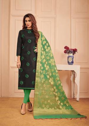 If Those Readymade Suit Does Not Lend You The Desired Comfort Than Grab This Designer Dress Material In Black Color Paired With Green Colored Bottom And Dupatta. This Pretty Dress Material Is Cotton Based Paired With Banarasi Silk Fabricated Dupatta. 