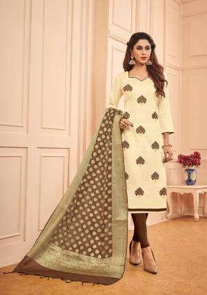Look Beautiful In This Deigner Straight Suit In Cream Color Paired With Contrasting Brown Colored Bottom And Dupatta. Its Top And Bottom Are Cotton Based Paired With Banarasi Silk Weaved Dupatta. Buy This Dress material And Get This Stitched As Per Your Desired Fit And Comfort. 