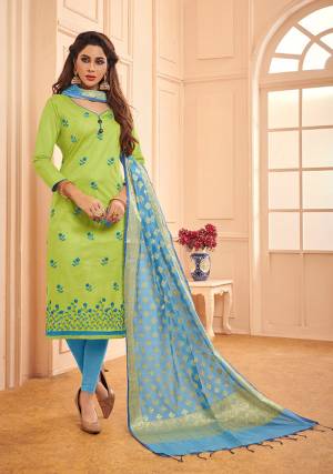 If Those Readymade Suit Does Not Lend You The Desired Comfort Than Grab This Designer Dress Material In Light Green Color Paired With Sky Blue Colored Bottom And Dupatta. This Pretty Dress Material Is Cotton Based Paired With Banarasi Silk Fabricated Dupatta. 