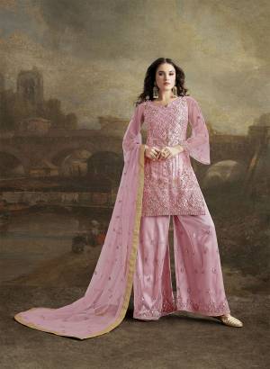Look Pretty In This Designer Suit In Pretty Pink Color. Its Top, Bottom And Dupatta Are Fabricated On Net. It Is Beautified With Subtle Tone To Tone Resham Embroidery Highlighted With Jari & Stone Work. 