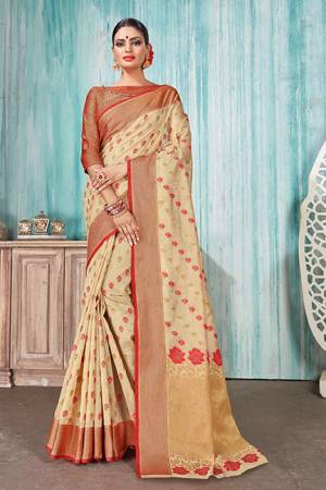 Celebrate This Festive Season With Beauty And Comfort In This Silk Based Cream Colored Saree Paired With Red Colored Blouse. This Saree Is Fabricated On Art Silk Paired With Jacquard Silk Fabricated Blouse. Buy Now.