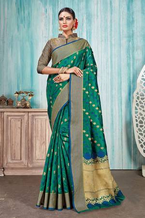 Celebrate This Festive Season With Beauty And Comfort In This Silk Based Sea Green Colored Saree Paired With Red Colored Blouse. This Saree Is Fabricated On Art Silk Paired With Jacquard Silk Fabricated Blouse. Buy Now.