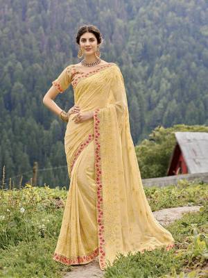 Grab This Elegant Looking Designer Saree In Light Yellow Color Paired With Light Yellow Colored Blouse. This Saree Is Fabricated On Georgette Paired With Art Silk Fabricated Blouse. It Has Pretty Tone To Tone And Contrasting Embroidery. Buy Now. 